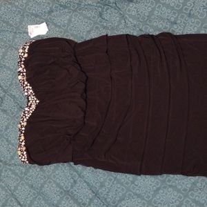 Black strapless dress with bejeweled neckline